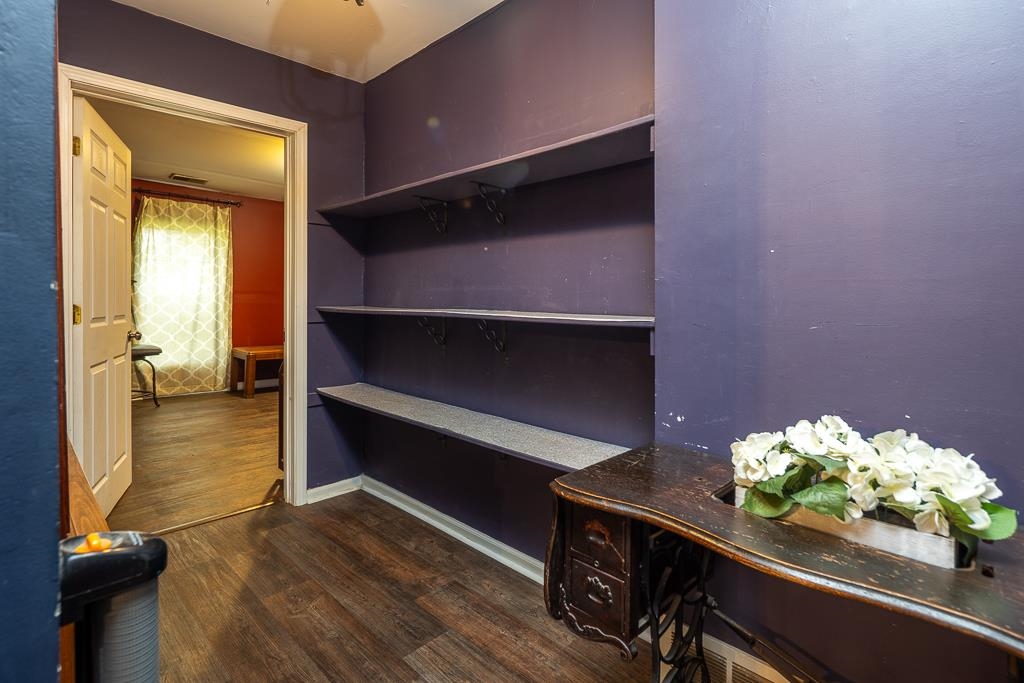 4036 Shelby Road Millington, TN 38053 - Photo 19 of 26 a room with painting on the wall and a potted plant