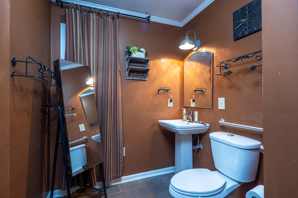 4036 Shelby Road Millington, TN 38053 - Photo 21 of 26 a bathroom with a sink a toilet and shower