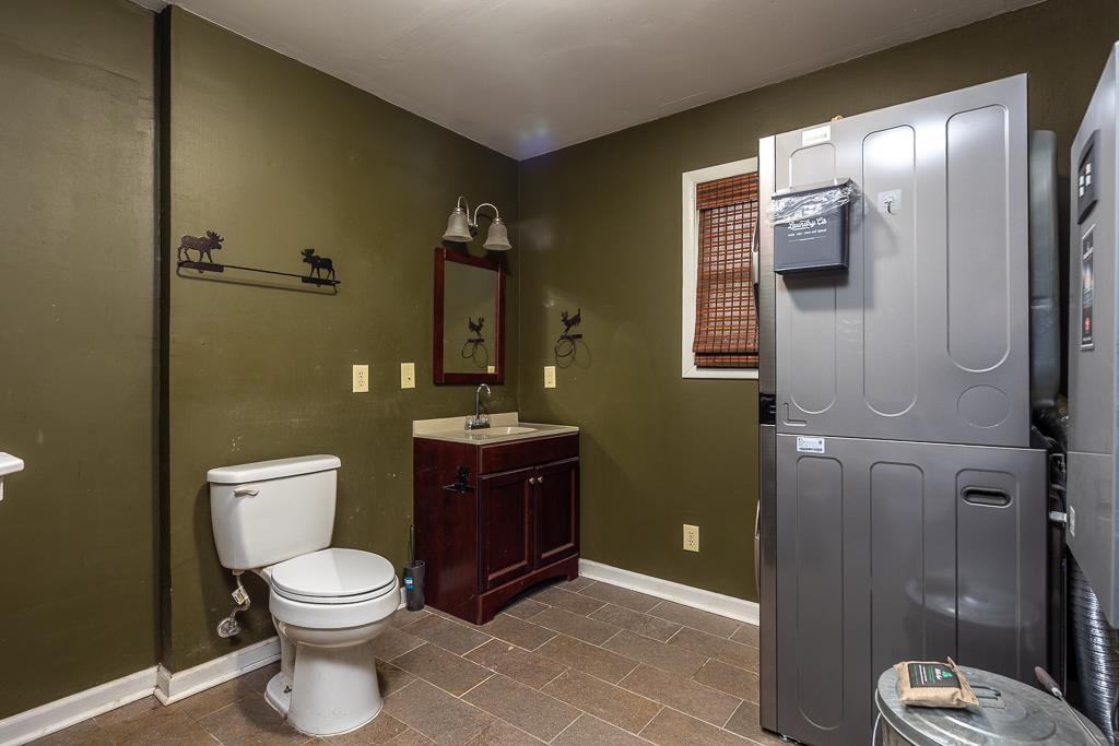 4036 Shelby Road Millington, TN 38053 - Photo 23 of 26 a bathroom with a toilet a sink and shower