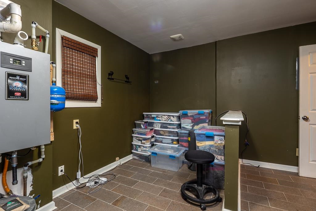 4036 Shelby Road Millington, TN 38053 - Photo 24 of 26 a bathroom with a toilet and a wooden floor