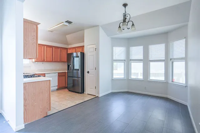 a view of kitchen with window and wooden floor
