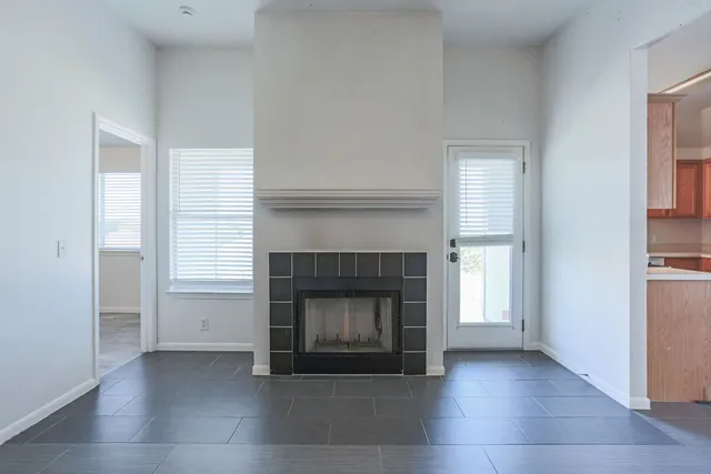 a room with a fireplace and a fireplace