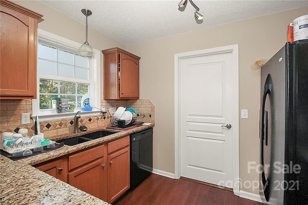 1407 George Dunn Road Rock Hill, SC 29730 - Photo 4 of 11 a kitchen with stainless steel appliances granite countertop a sink stove and refrigerator