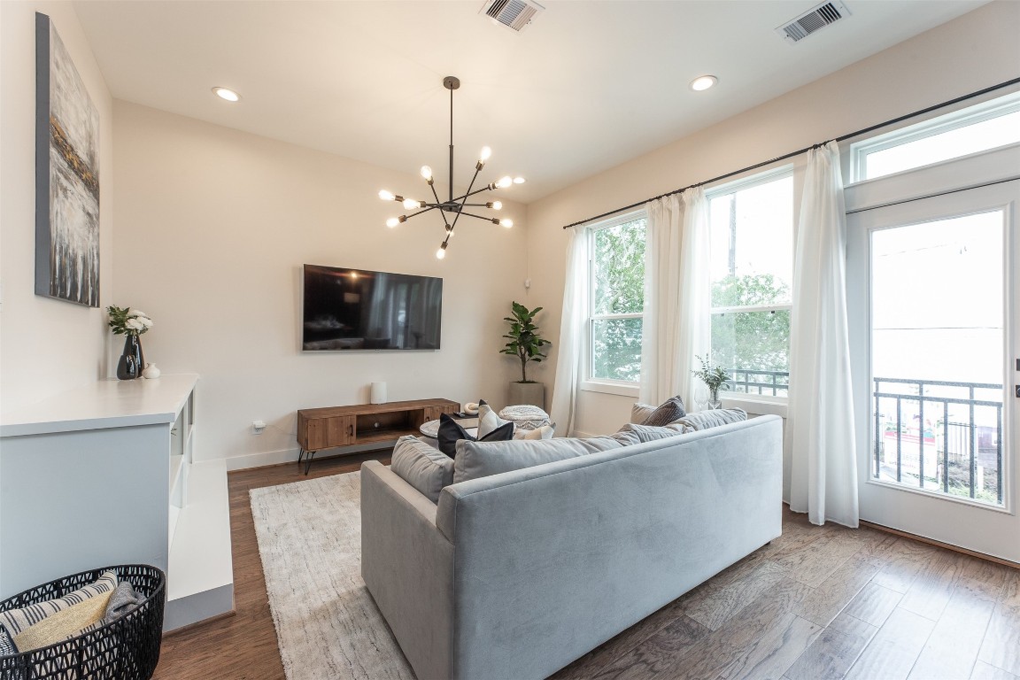 605 Middle Street Houston, TX 77003 - Photo 3 of 33 a living room with furniture and a flat screen tv