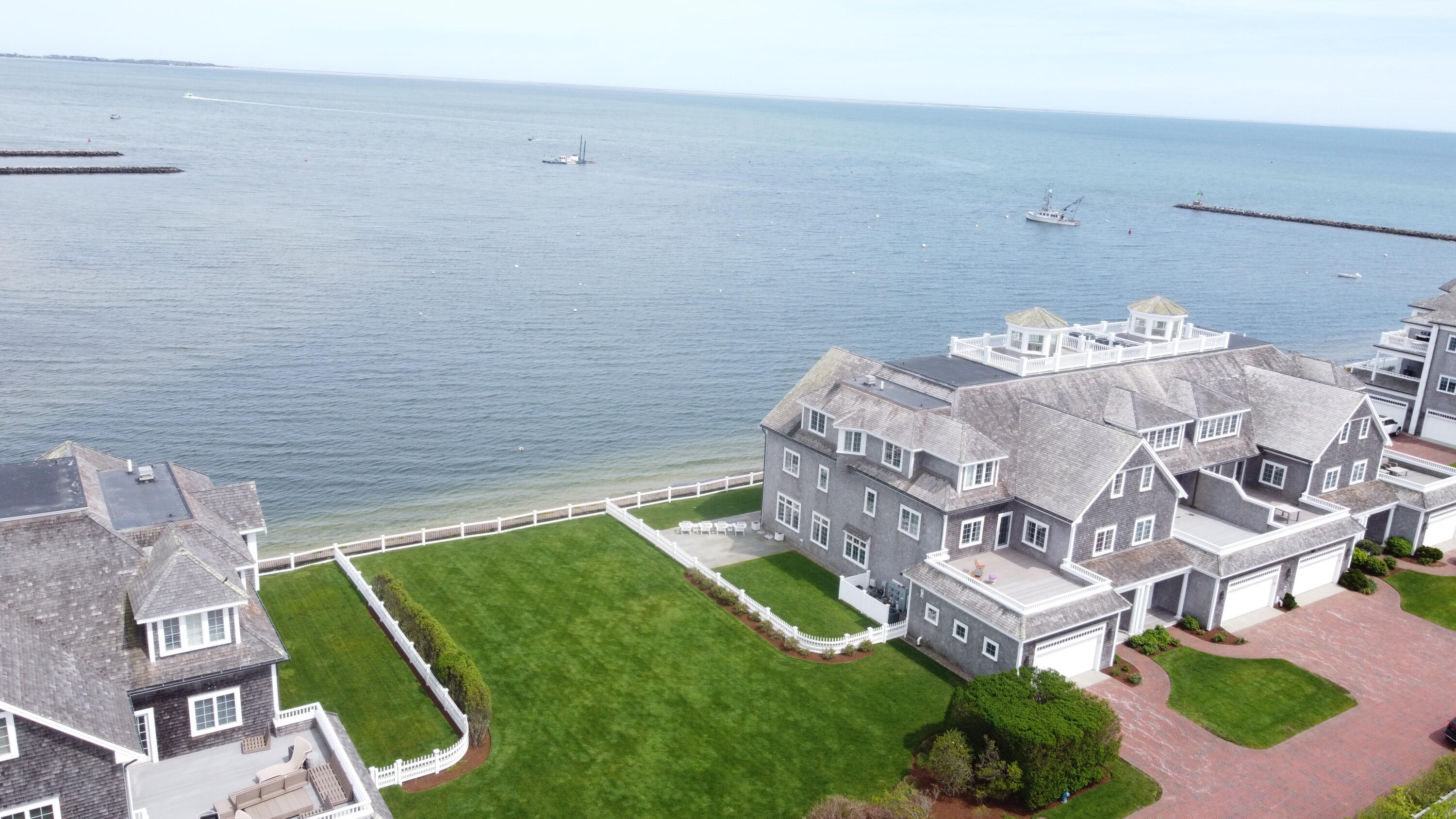 23 Snow Inn Road, Unit 7 Harwich Port, MA 02646 - Photo 3 of 37 a aerial view of a chairs and table on the terrace