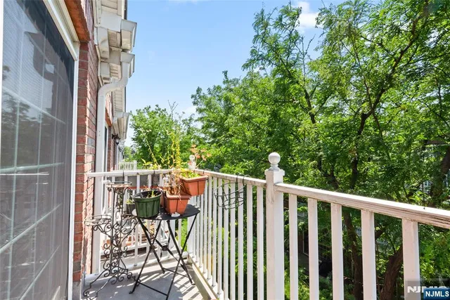 a view of balcony with furniture