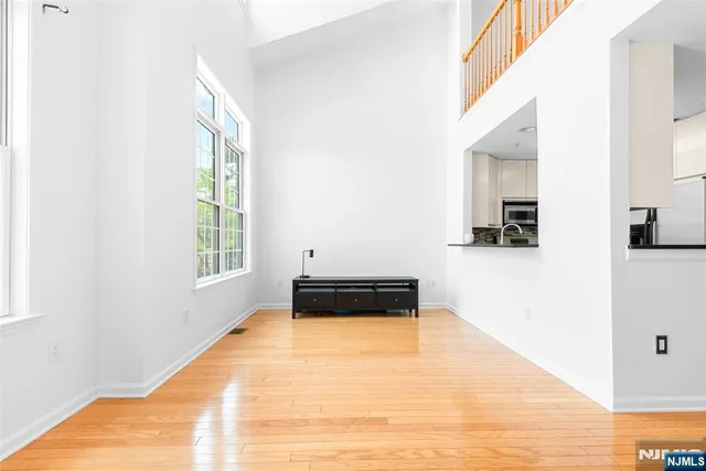 a living room with a bed furniture and a window