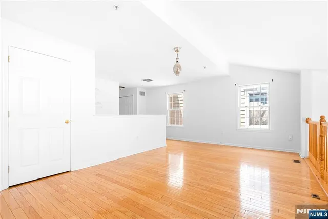 a view of a livingroom with wooden floor