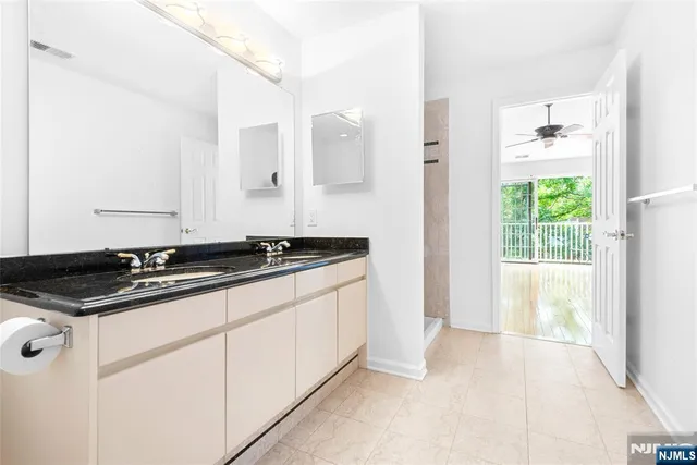 a kitchen with granite countertop a sink and a stove