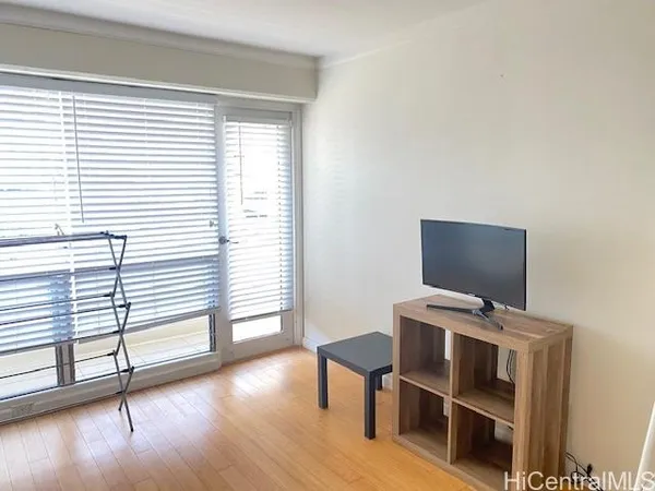 a view of workspace with wooden floor windows and piano