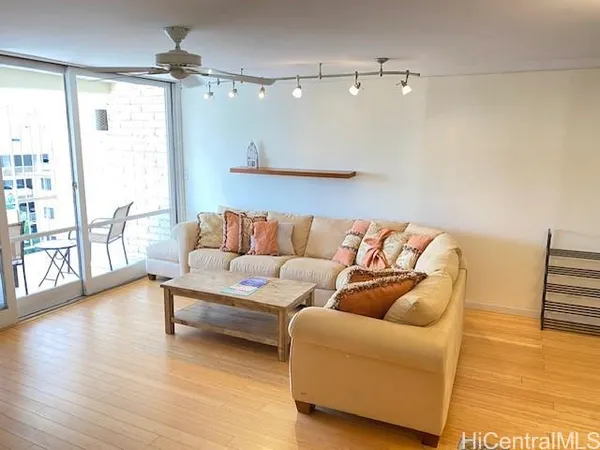 a living room with furniture and a large window