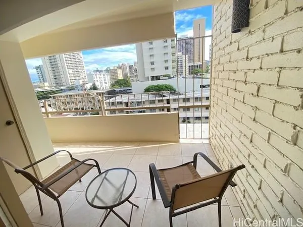 a view of a balcony with chairs