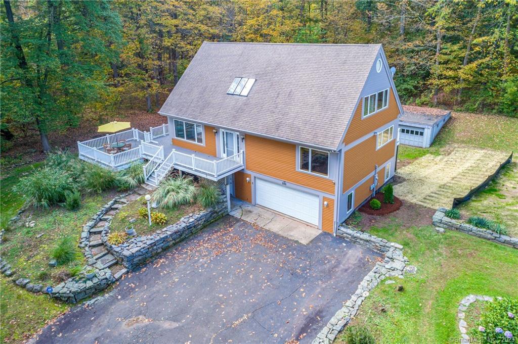 285 Crystal Lake Road Middletown, CT 06457 - Photo 1 of 1 an aerial view of a house with a yard basket ball court and outdoor seating