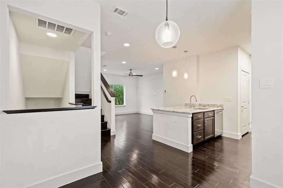 5924 Hudson Street, Unit F Dallas, TX 75206 - Photo 5 of 25 a kitchen with a sink and a stove top oven