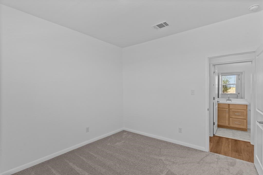 1018 Vanderscile Road Hutto, TX 78634 - Photo 12 of 27 wooden floor in an empty room