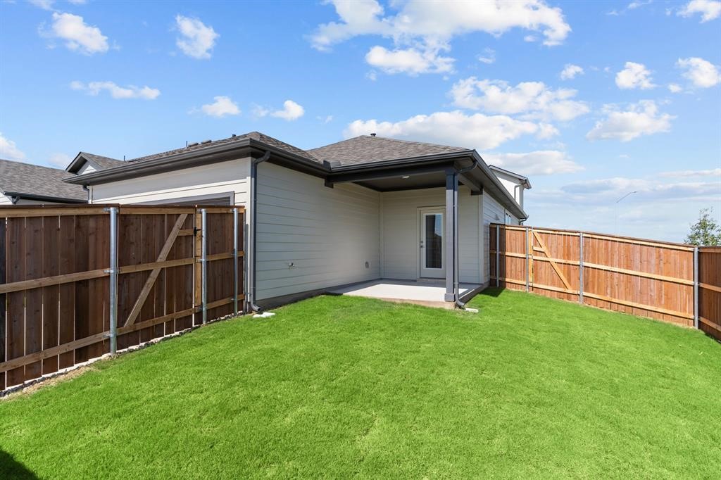 1018 Vanderscile Road Hutto, TX 78634 - Photo 20 of 27 a view of an house with backyard