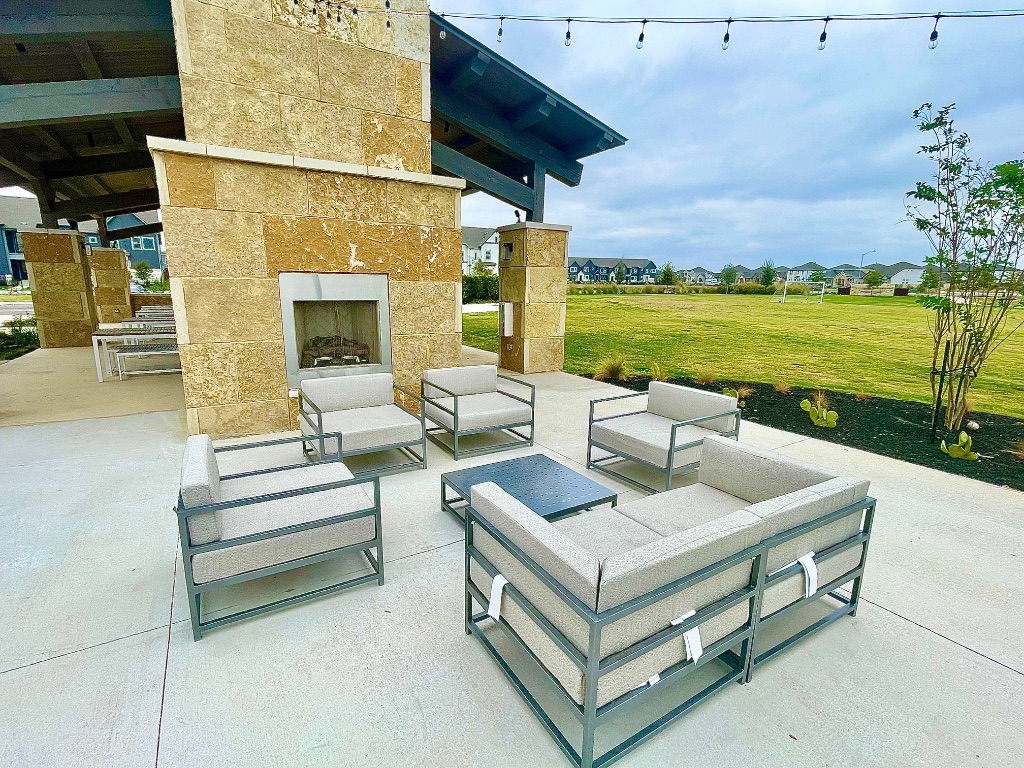 1018 Vanderscile Road Hutto, TX 78634 - Photo 26 of 27 a view of a patio with couches potted plants and ocean view