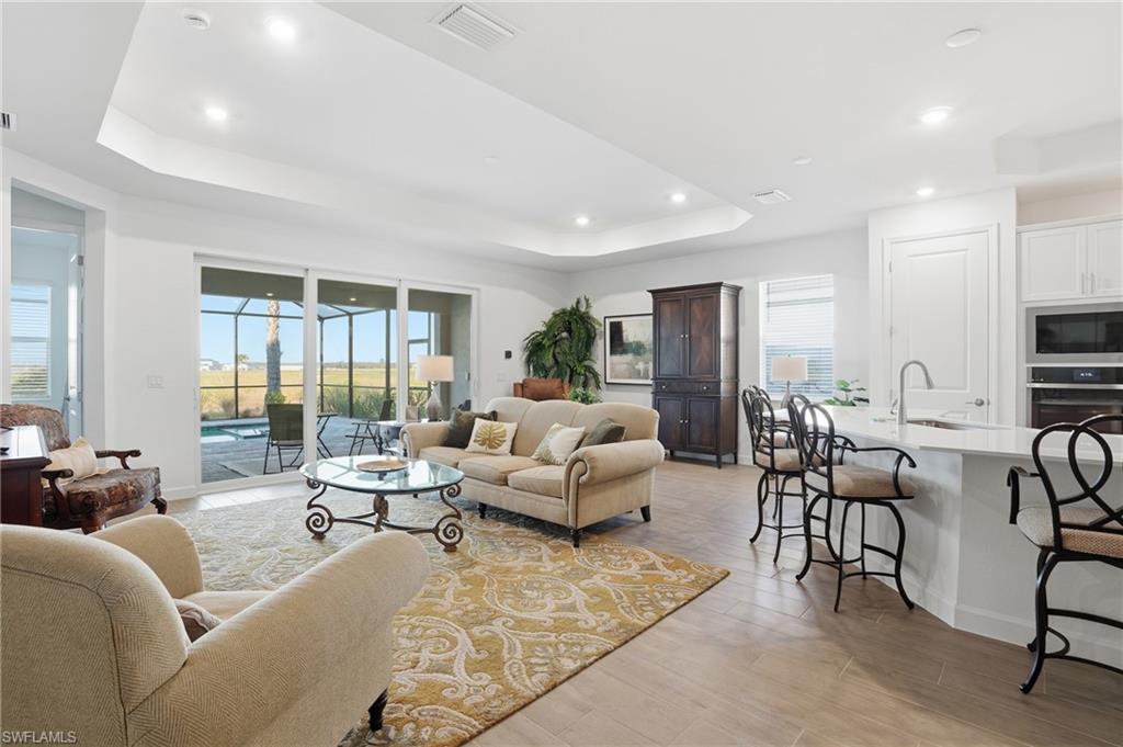 44481 Mesquite Lane Babcock Ranch, FL 33982 - Photo 11 of 34 a living room with furniture and a large window