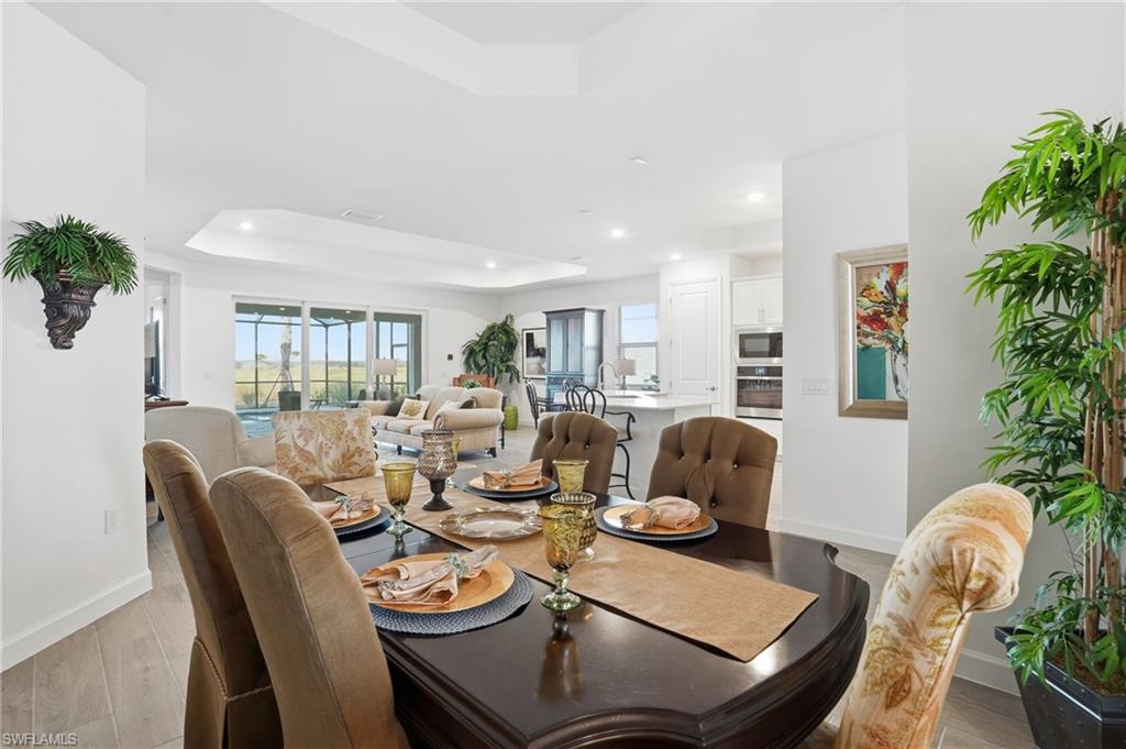 44481 Mesquite Lane Babcock Ranch, FL 33982 - Photo 13 of 34 a living room with furniture potted plant and a potted plant