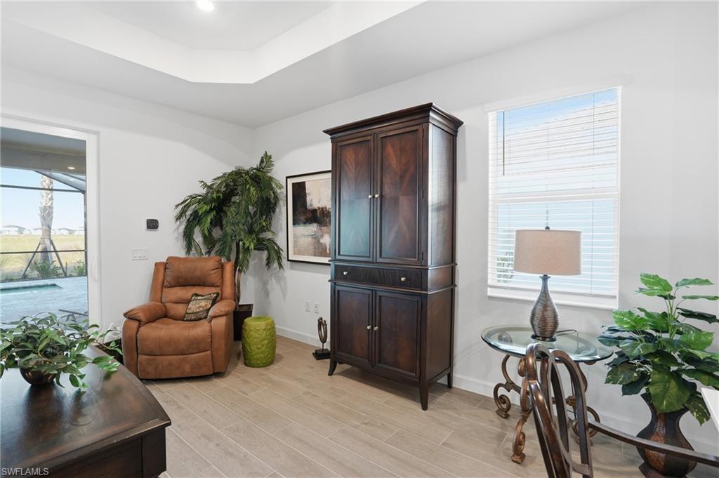 44481 Mesquite Lane Babcock Ranch, FL 33982 - Photo 16 of 34 a living room with furniture and a flat screen tv