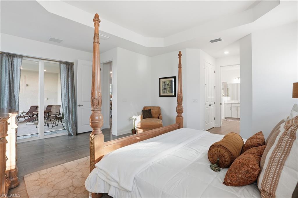 44481 Mesquite Lane Babcock Ranch, FL 33982 - Photo 20 of 34 a bedroom with a bed and a couch