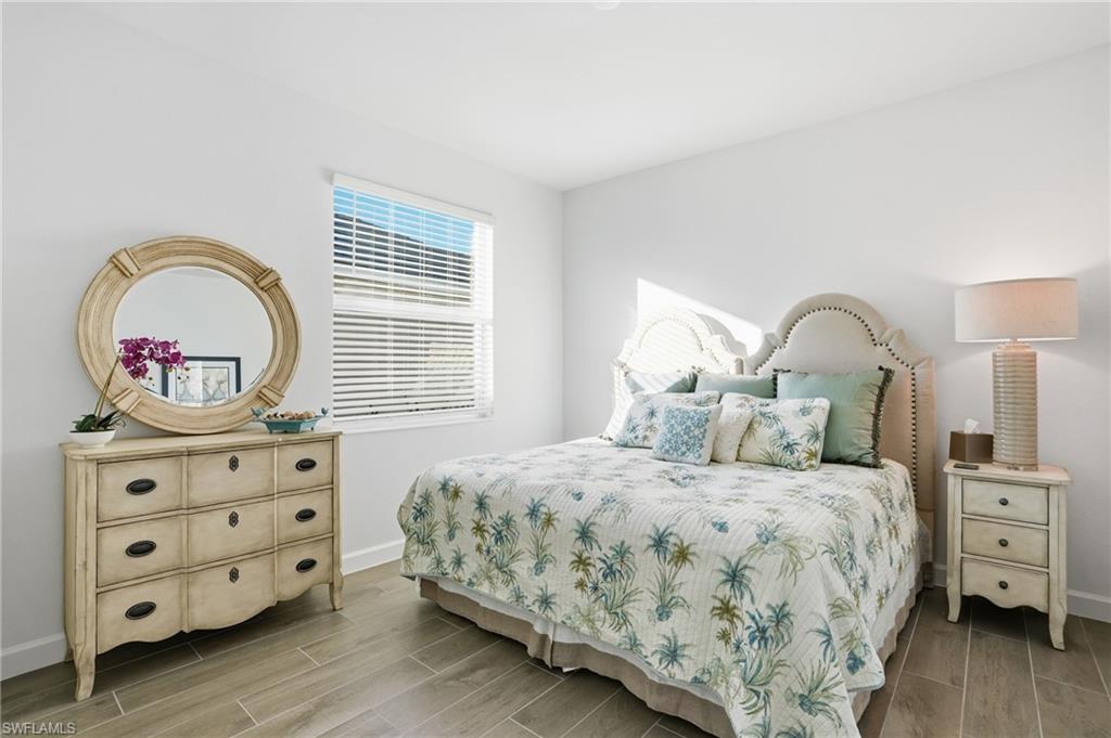 44481 Mesquite Lane Babcock Ranch, FL 33982 - Photo 28 of 34 a bedroom with a bed and a dresser
