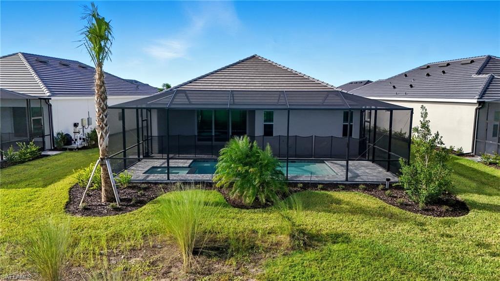 44481 Mesquite Lane Babcock Ranch, FL 33982 - Photo 3 of 34 a front view of a house with garden