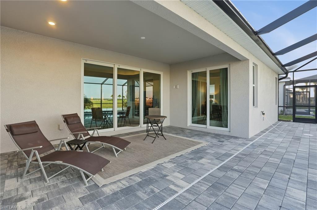 44481 Mesquite Lane Babcock Ranch, FL 33982 - Photo 31 of 34 a building outdoor space with patio furniture and potted plants