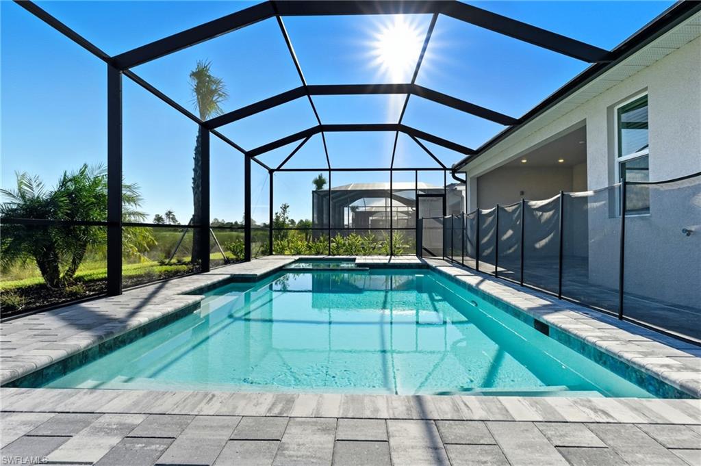 44481 Mesquite Lane Babcock Ranch, FL 33982 - Photo 34 of 34 a swimming pool with an outdoor seating yard and barbeque oven