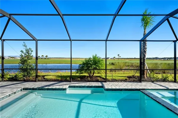 a view of a swimming pool with a chair and floor