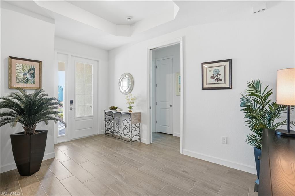 44481 Mesquite Lane Babcock Ranch, FL 33982 - Photo 5 of 34 a living room with furniture and a potted plant
