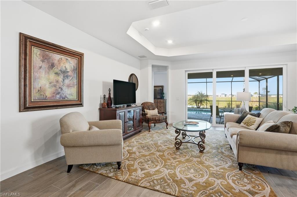 44481 Mesquite Lane Babcock Ranch, FL 33982 - Photo 10 of 34 a living room with furniture and a flat screen tv
