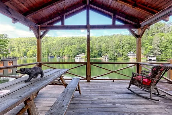 a view of a lake with houses in front of it