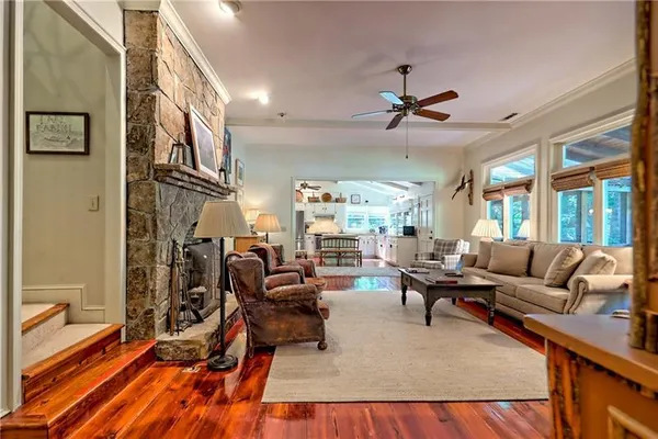 a living room with furniture or couch and a chandelier