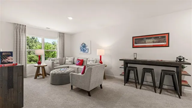 a view of a house with backyard and a tree