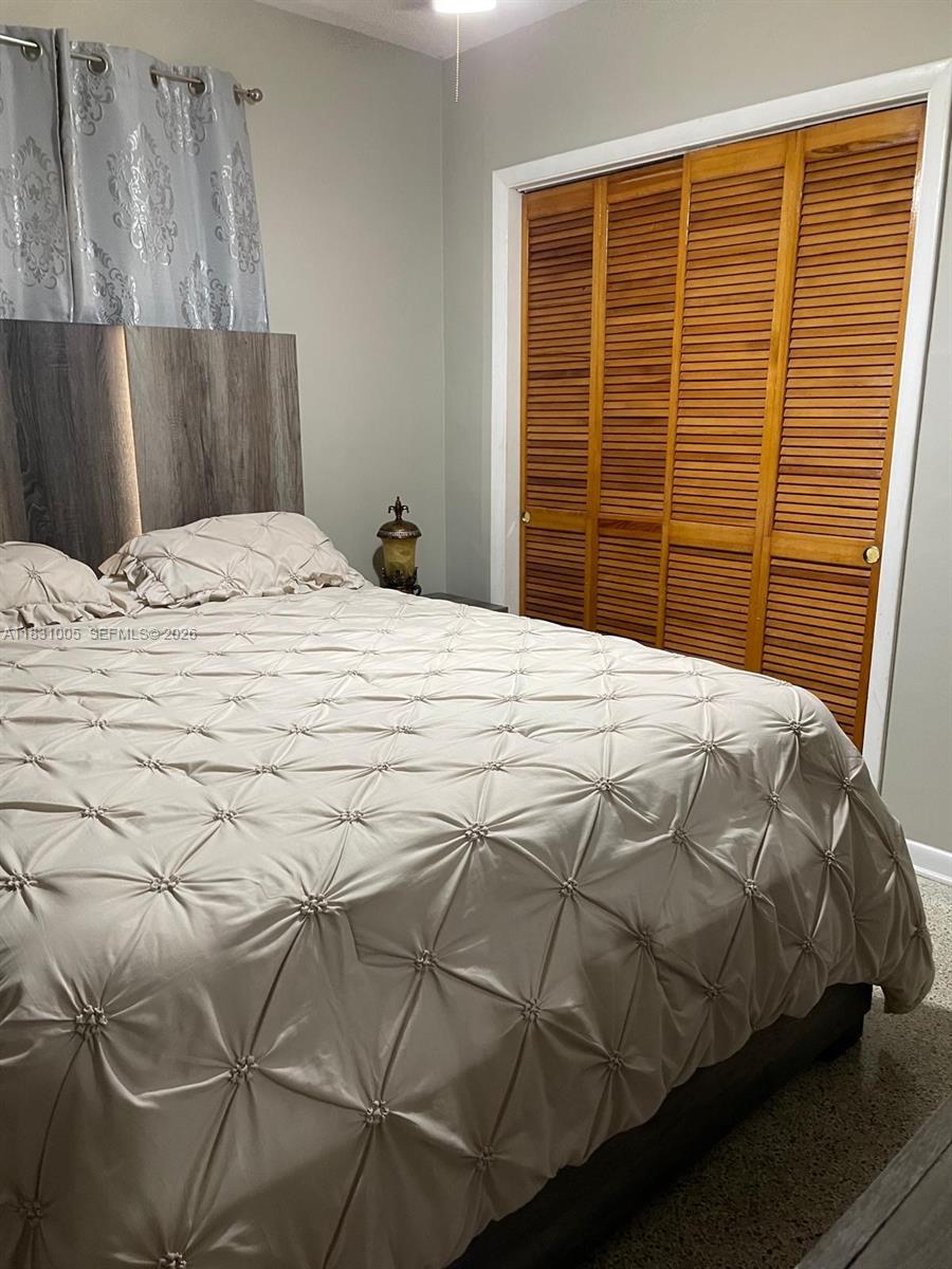 266 East 12th Street Hialeah, FL 33010 - Photo 12 of 19 a bedroom with a bed and closet