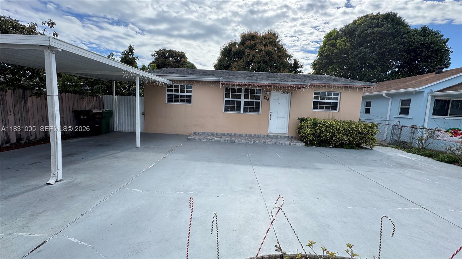 266 East 12th Street Hialeah, FL 33010 - Photo 2 of 19 a view of a house with a backyard