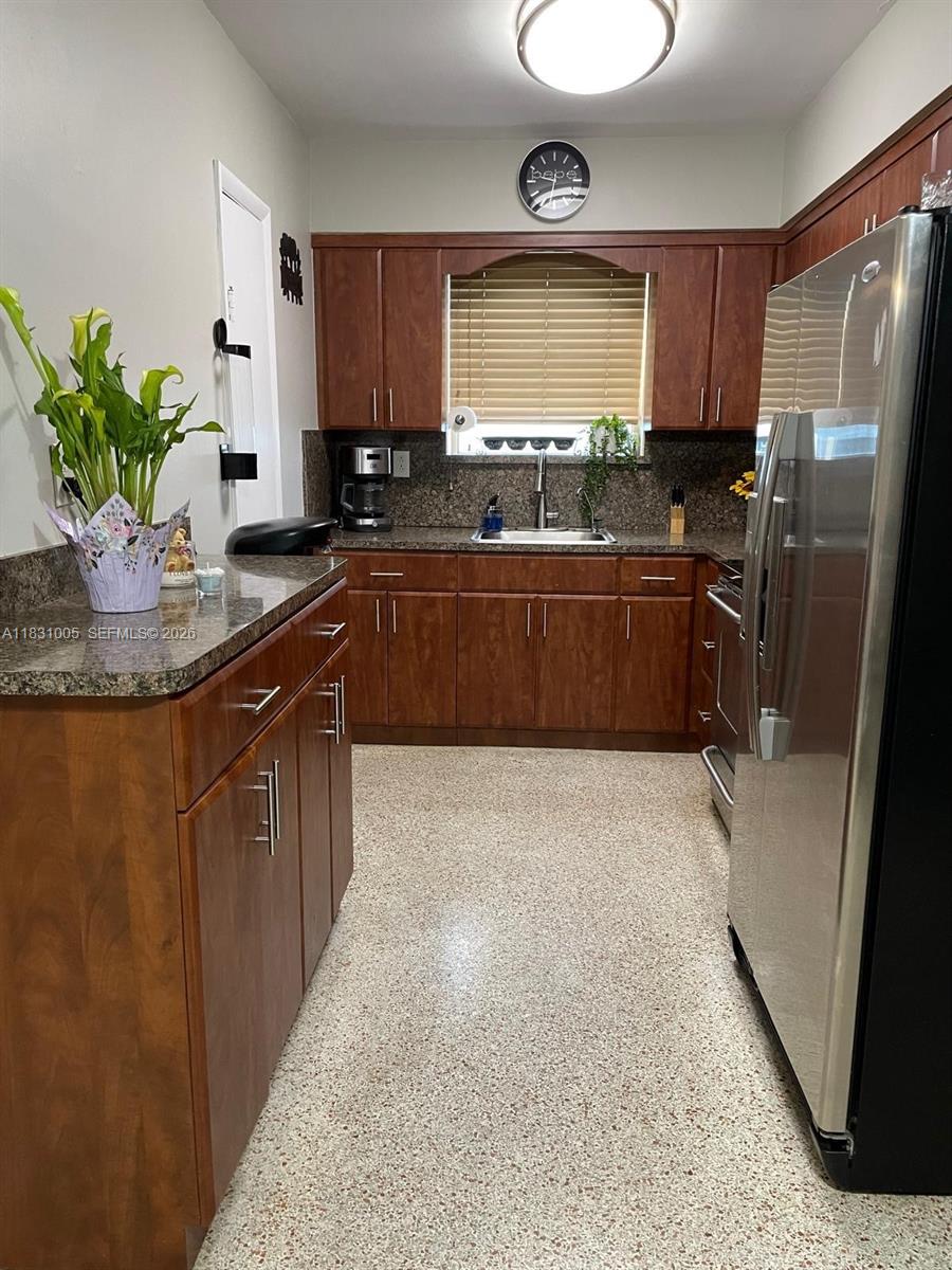 266 East 12th Street Hialeah, FL 33010 - Photo 6 of 19 a kitchen with stainless steel appliances granite countertop a refrigerator a stove and a refrigerator