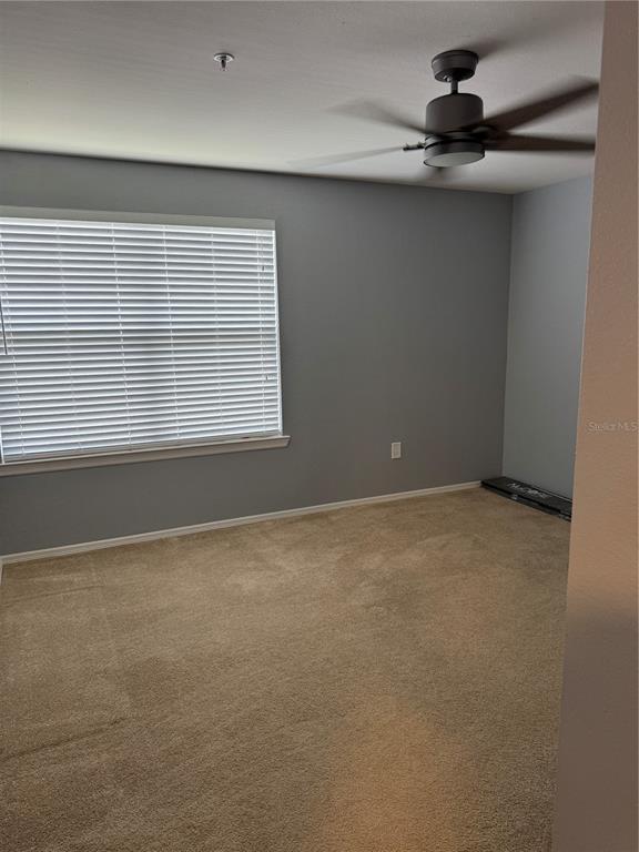 416 Summit Ridge Place, Unit 316 Longwood, FL 32779 - Photo 12 of 24 a view of an empty room with a window