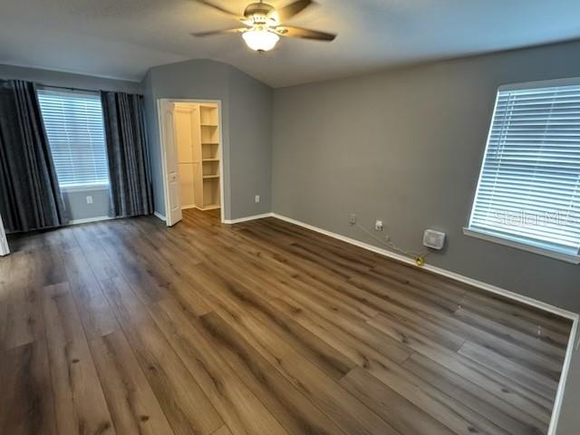 416 Summit Ridge Place, Unit 316 Longwood, FL 32779 - Photo 17 of 24 wooden floor in an empty room with a window