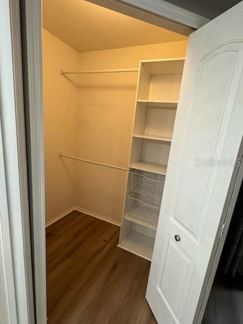 416 Summit Ridge Place, Unit 316 Longwood, FL 32779 - Photo 20 of 24 a view of an empty room with wooden floor and a window