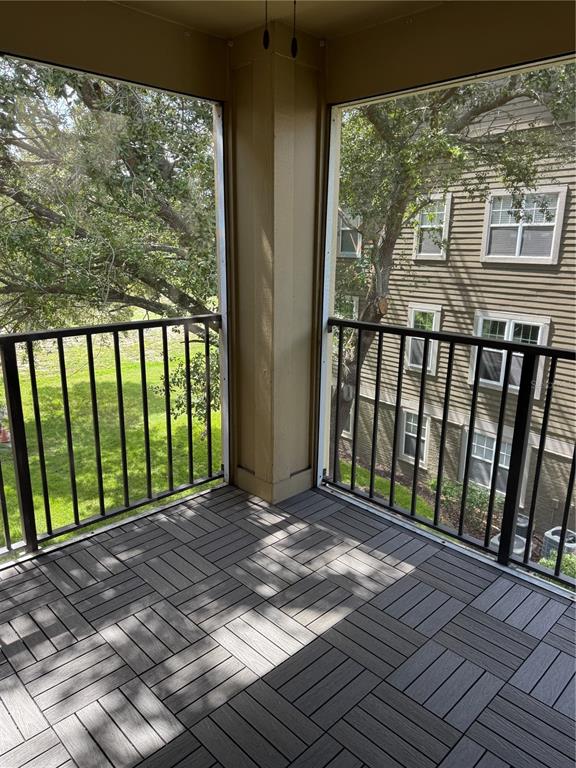 416 Summit Ridge Place, Unit 316 Longwood, FL 32779 - Photo 24 of 24 a view of a balcony with wooden floor