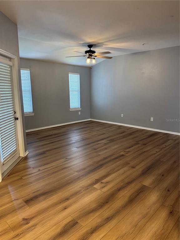 416 Summit Ridge Place, Unit 316 Longwood, FL 32779 - Photo 3 of 24 wooden floor in an empty room with a window