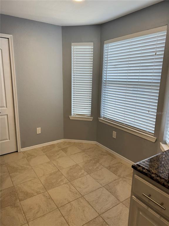 416 Summit Ridge Place, Unit 316 Longwood, FL 32779 - Photo 9 of 24 a view of an empty room with a window