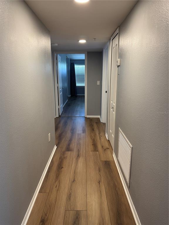 416 Summit Ridge Place, Unit 316 Longwood, FL 32779 - Photo 10 of 24 a view of hallway with wooden floor