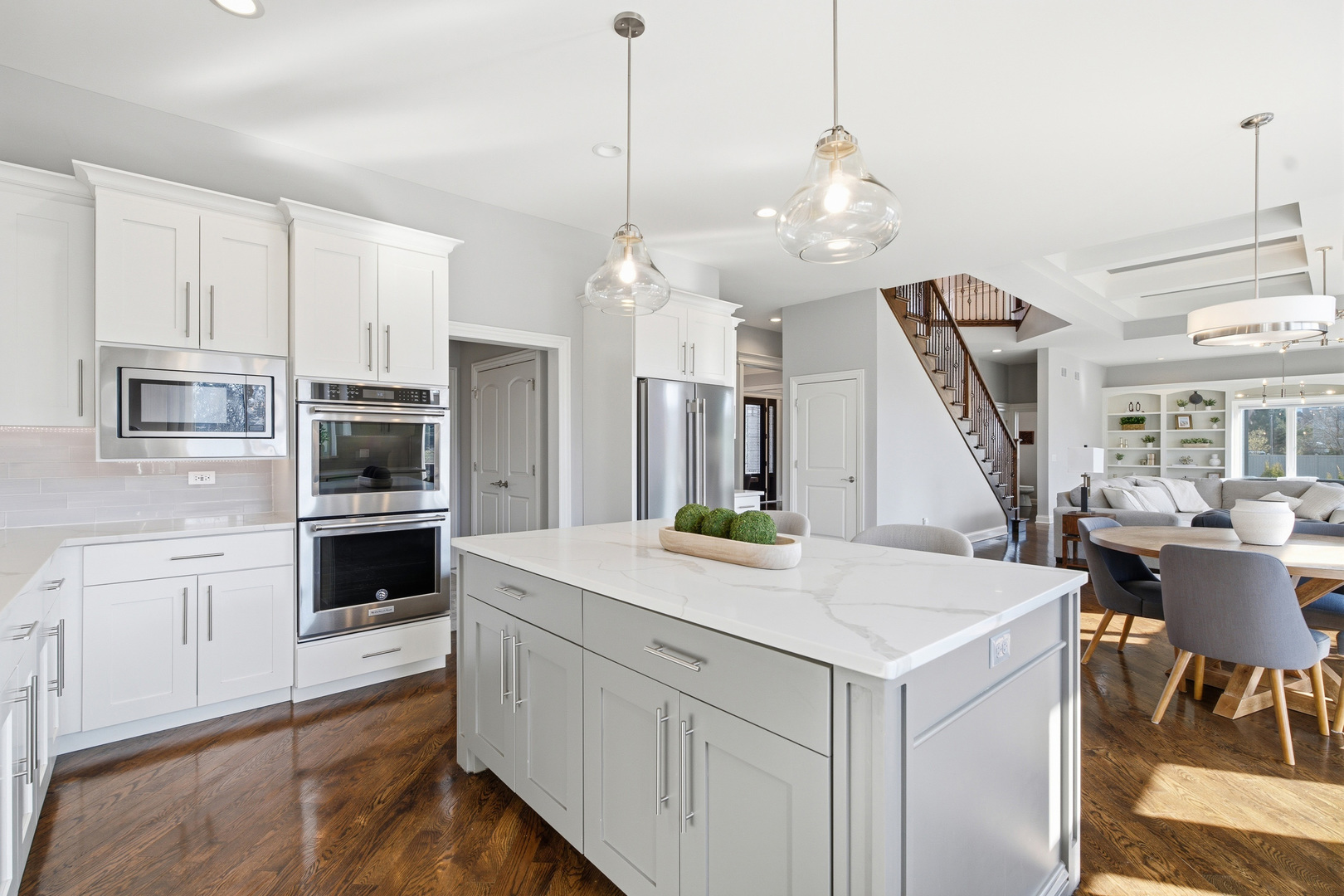 28 Pinnacle Court Naperville, IL 60565 - Photo 12 of 40 a open kitchen with stainless steel appliances kitchen island a refrigerator and a stove