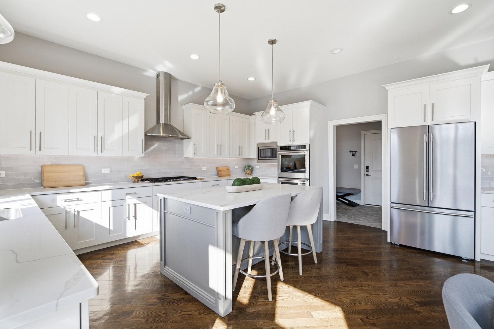 28 Pinnacle Court Naperville, IL 60565 - Photo 14 of 40 a open kitchen with stainless steel appliances granite countertop a refrigerator a stove a sink a dining table and chairs with wooden floor