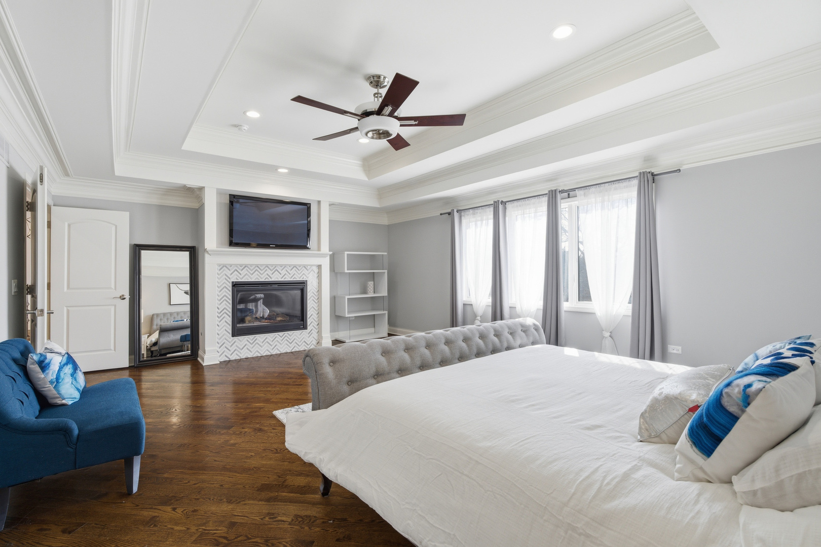 28 Pinnacle Court Naperville, IL 60565 - Photo 16 of 40 a spacious bedroom with a bed and a fireplace