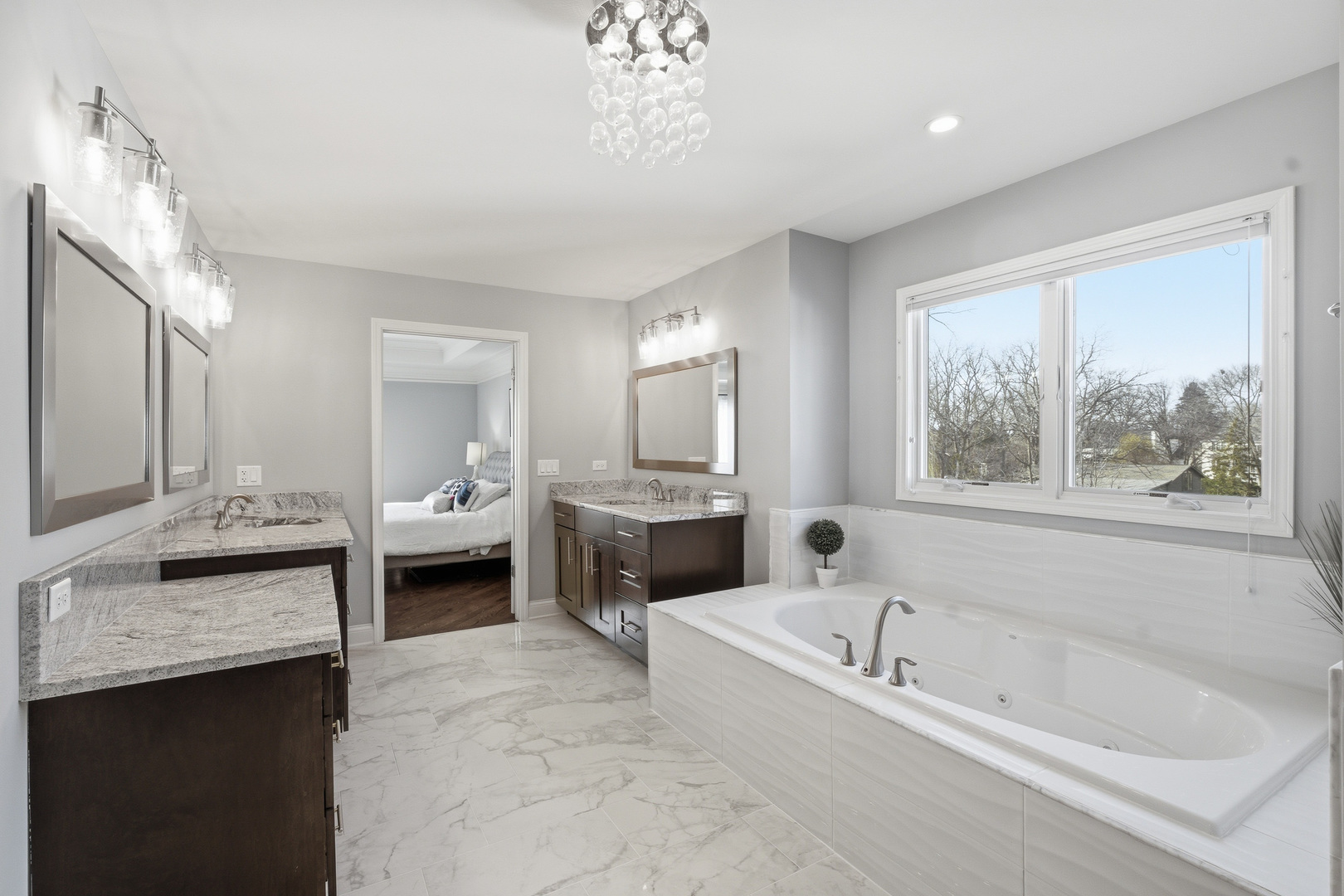 28 Pinnacle Court Naperville, IL 60565 - Photo 19 of 40 a spacious bathroom with a granite countertop tub sink and mirror