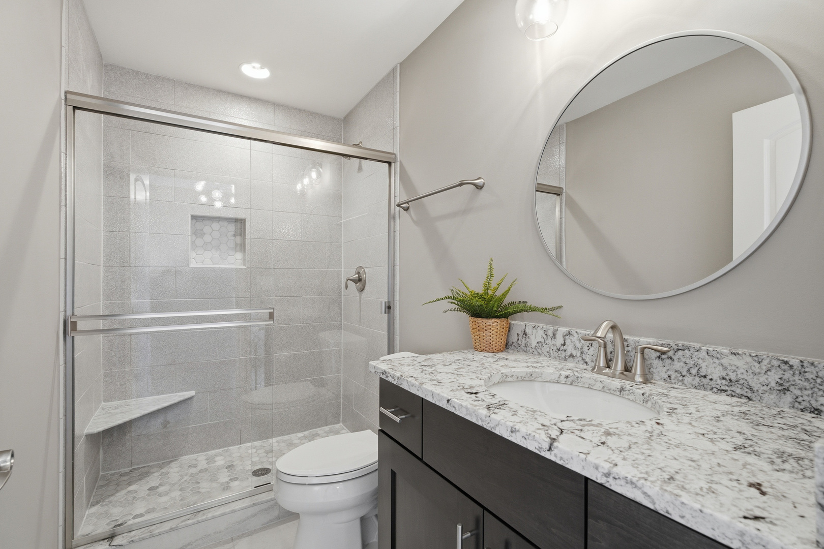 28 Pinnacle Court Naperville, IL 60565 - Photo 24 of 40 a bathroom with a granite countertop sink toilet and shower